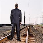 Train tracks man standing